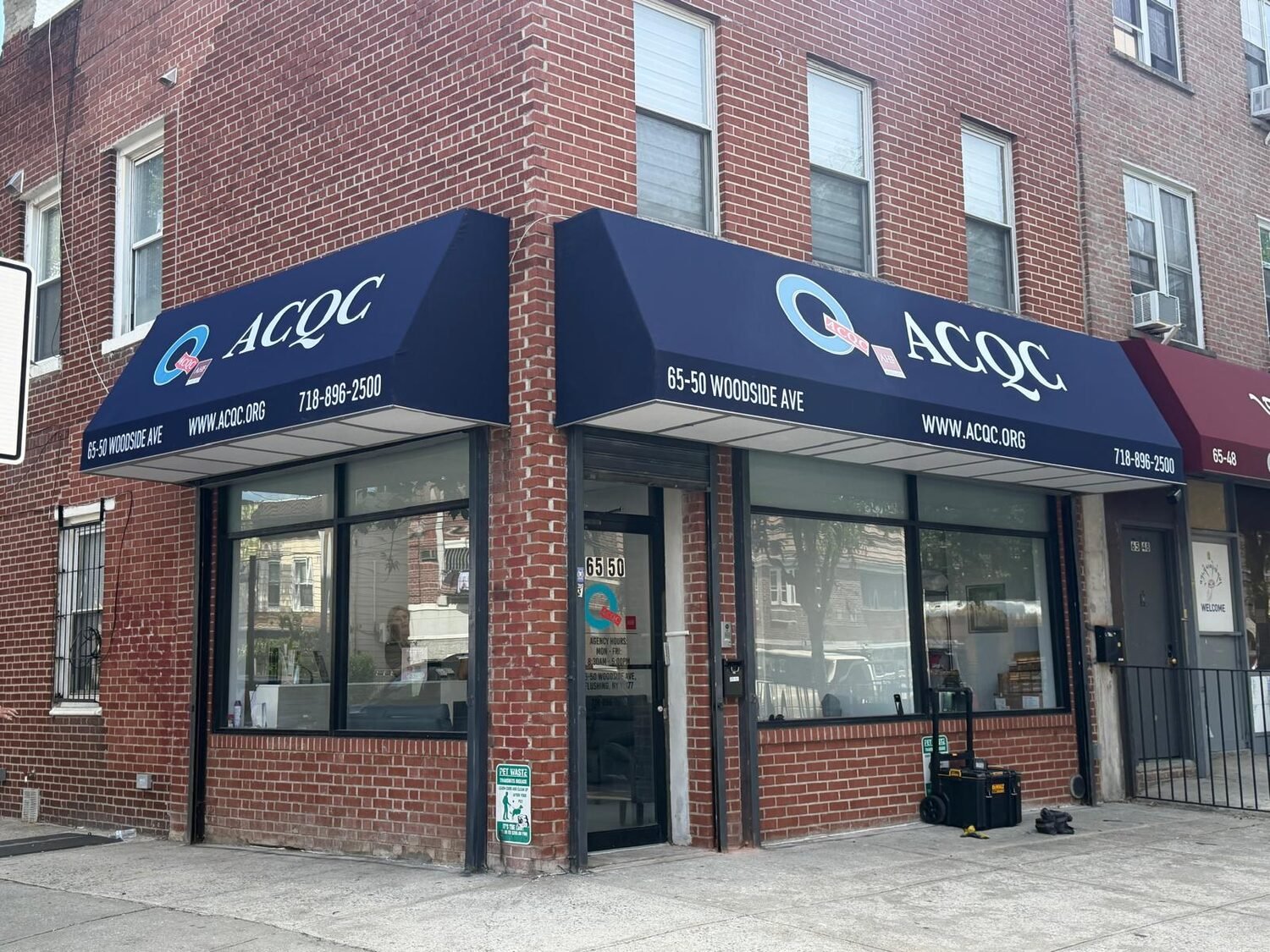 Wrap-around storefront awnings for ACQC