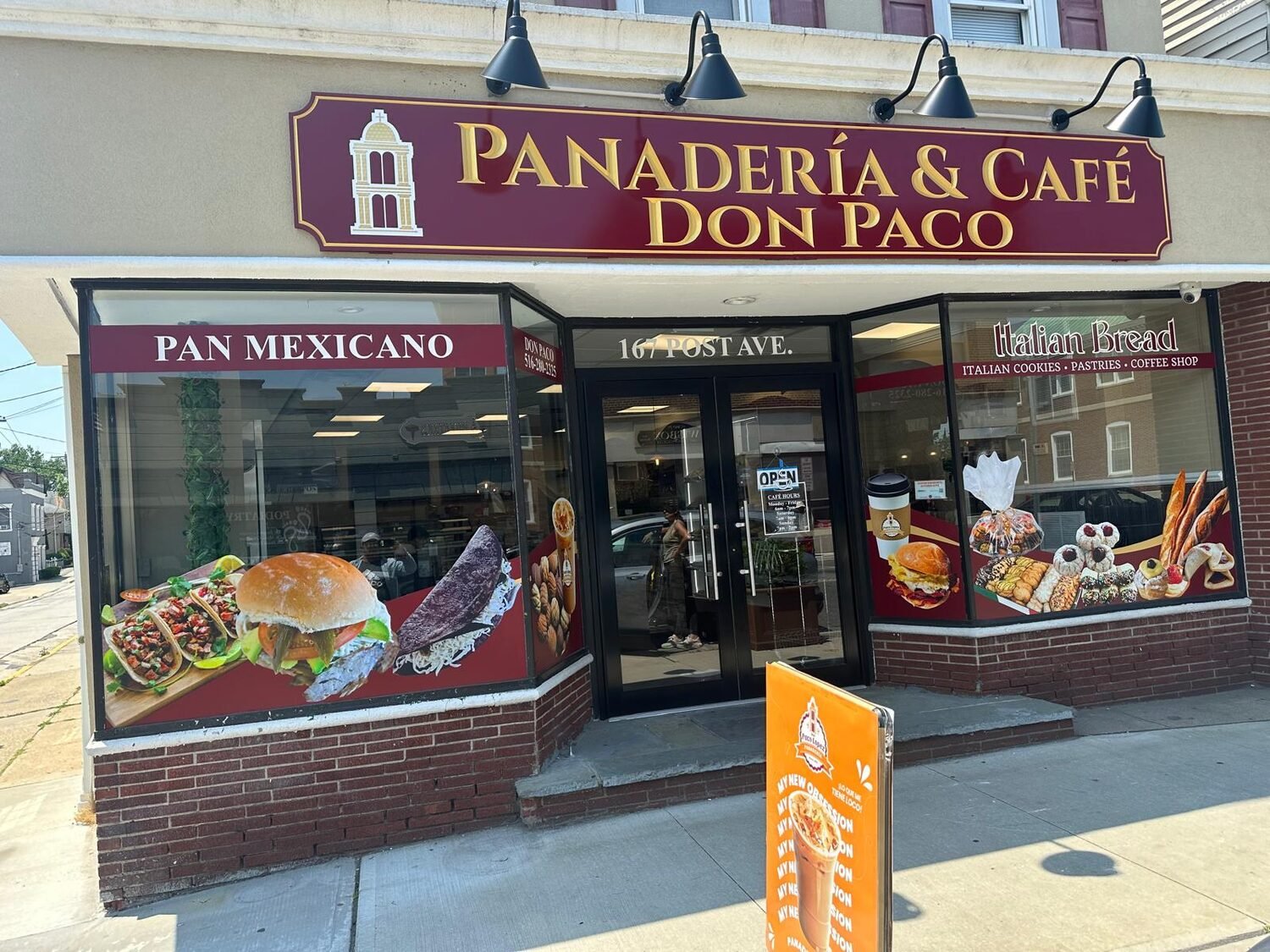 Carved storefront sign for Panadería & Café Don Paco