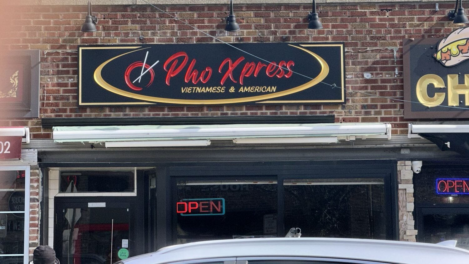 Carved and gilded sign for Pho Xpress