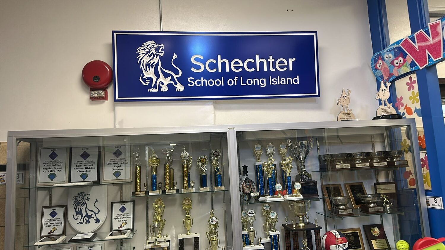 Carved sign in the trophy hall for Schechter School of Long Island