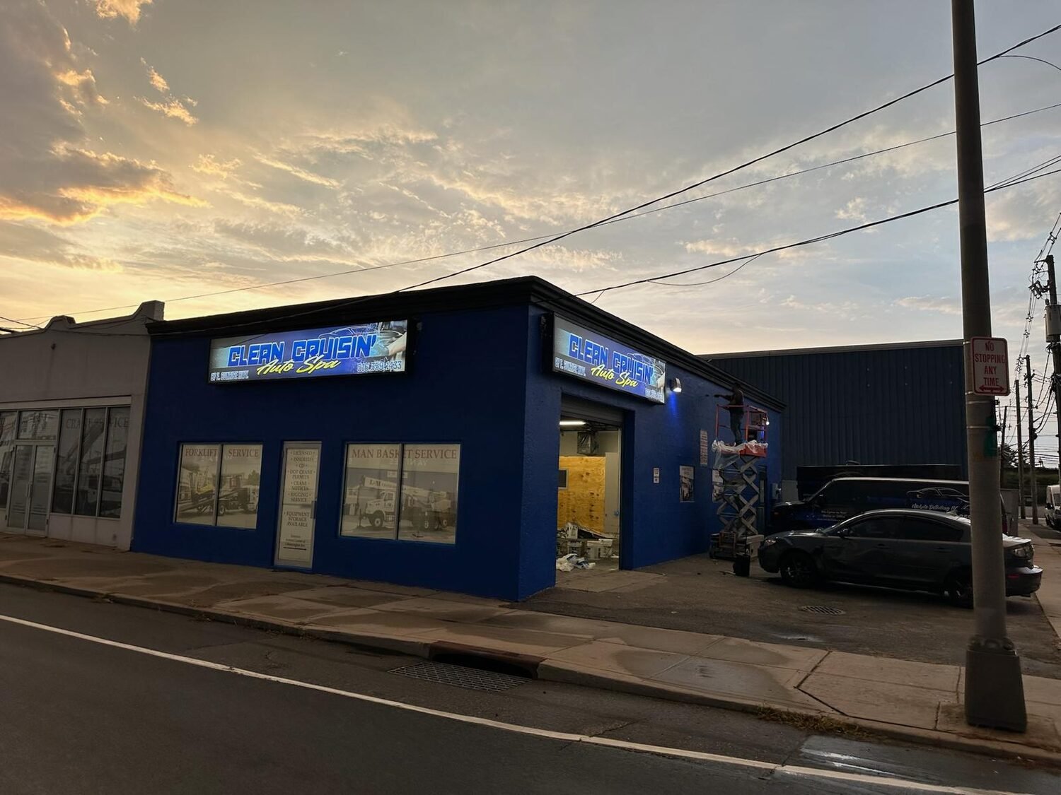 Light box signs at dusk for Clean Cruisin' Auto Spa