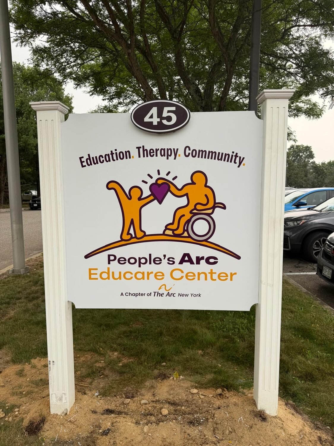 Post-and-panel monument sign for People's Arc Educare Center