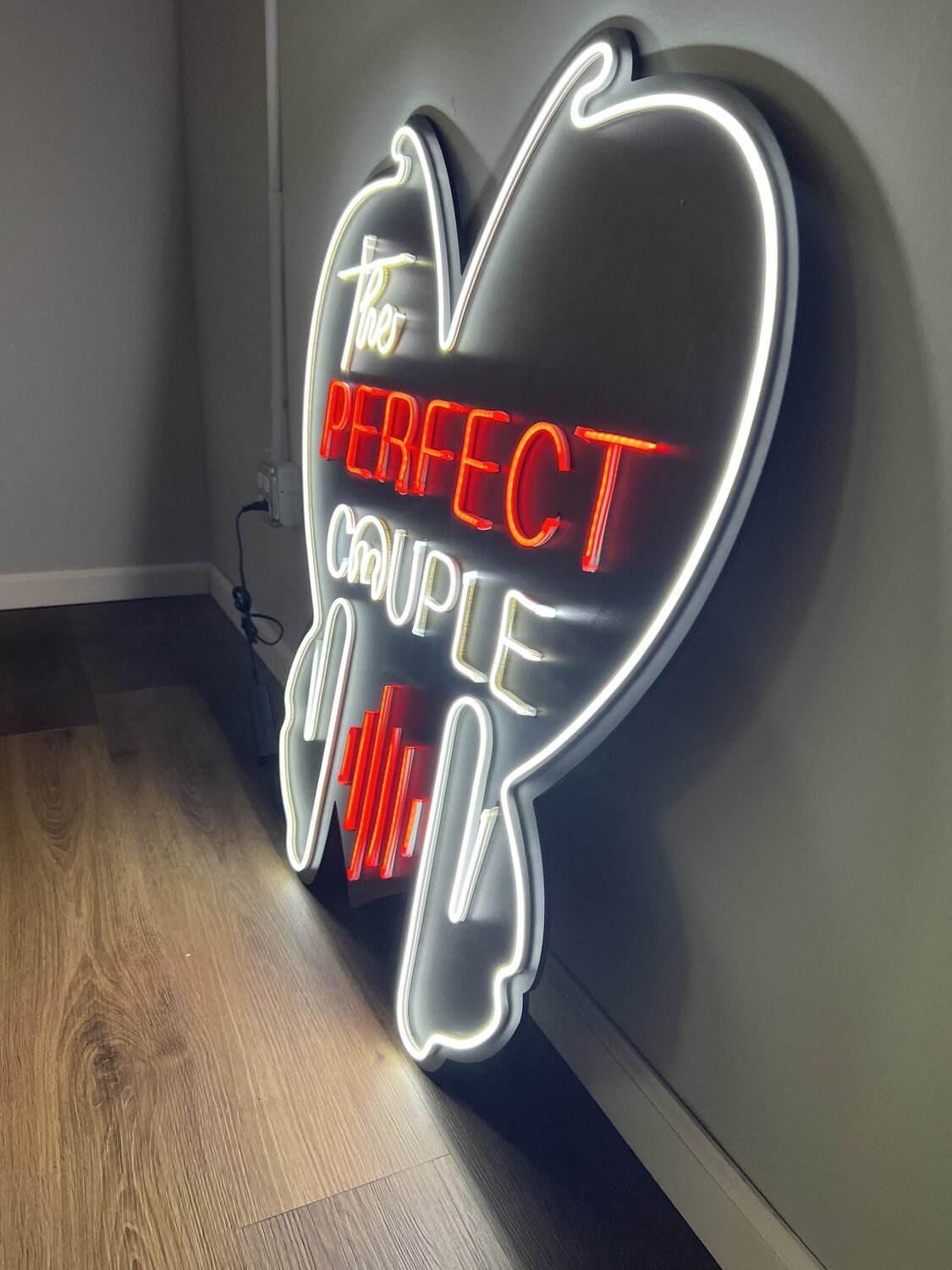 Custom neon-style sign for The Perfect Couple
