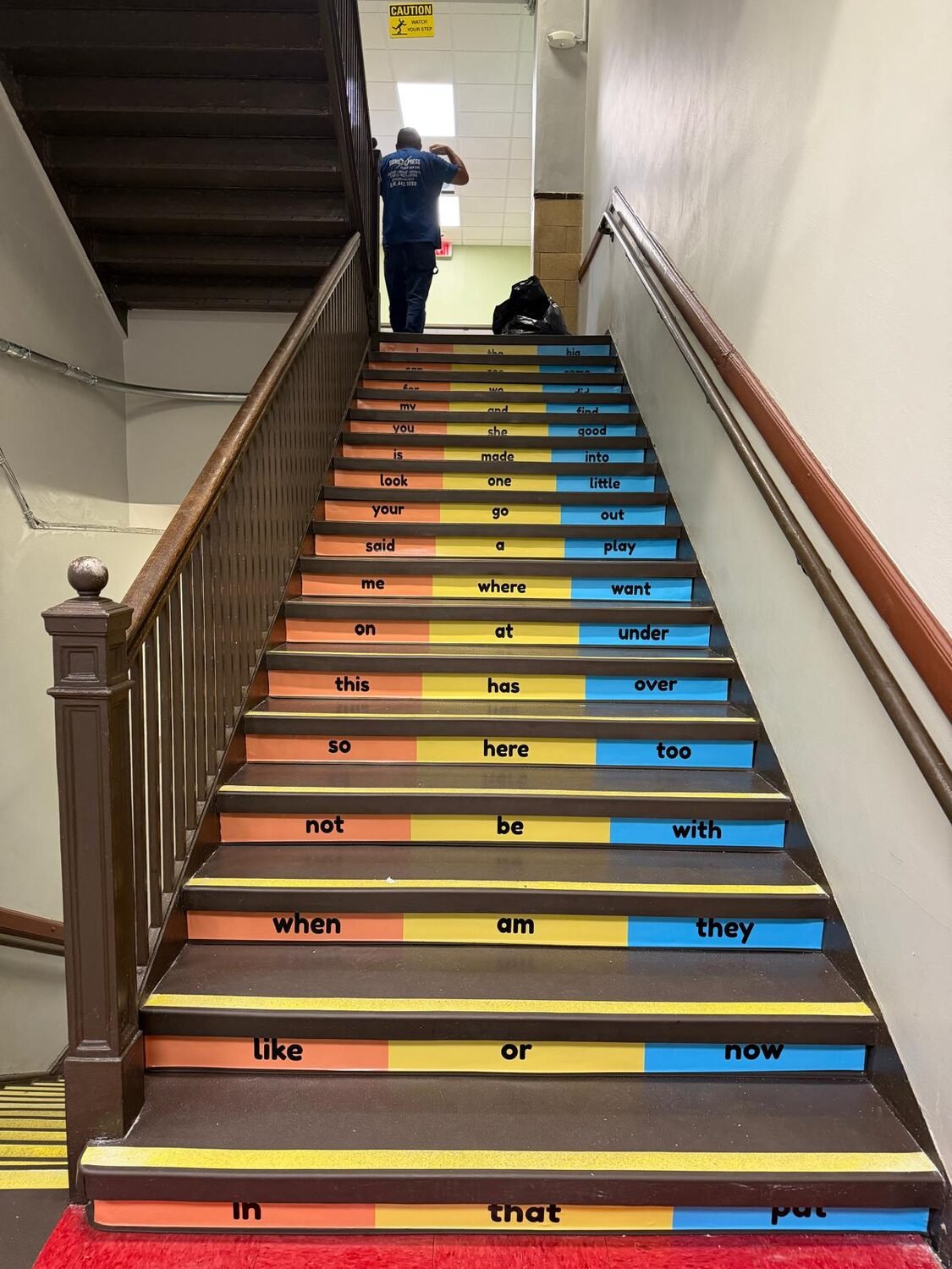 Stair risers turned into a reading wall for School