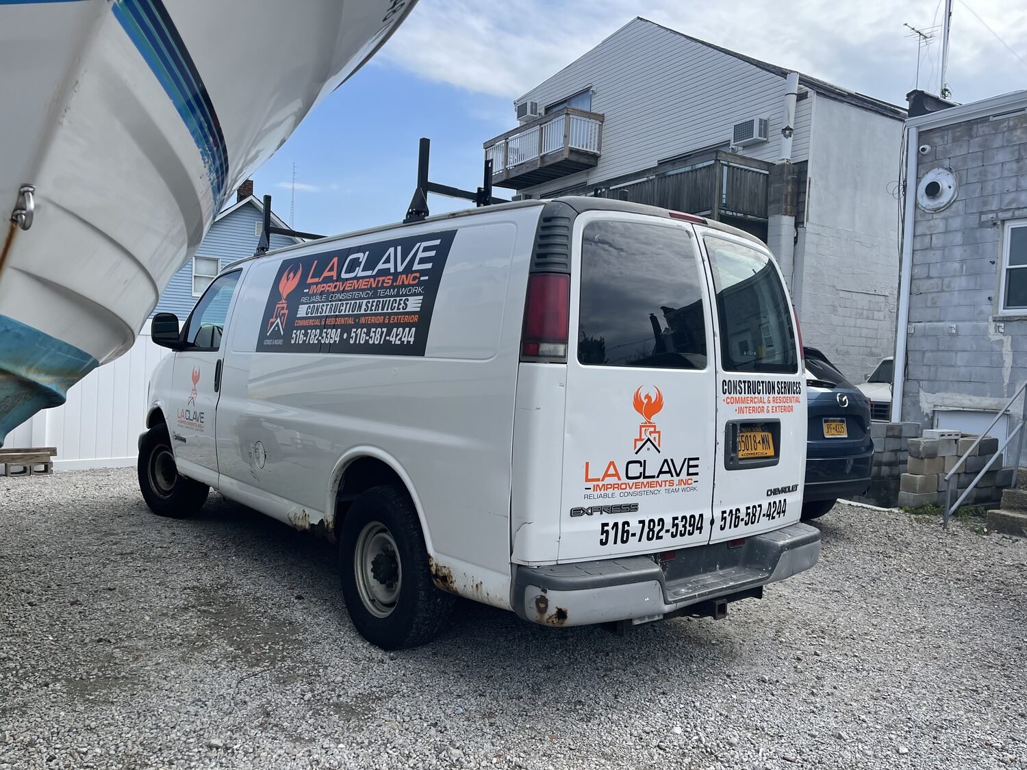 Van lettering for La Clave Improvements