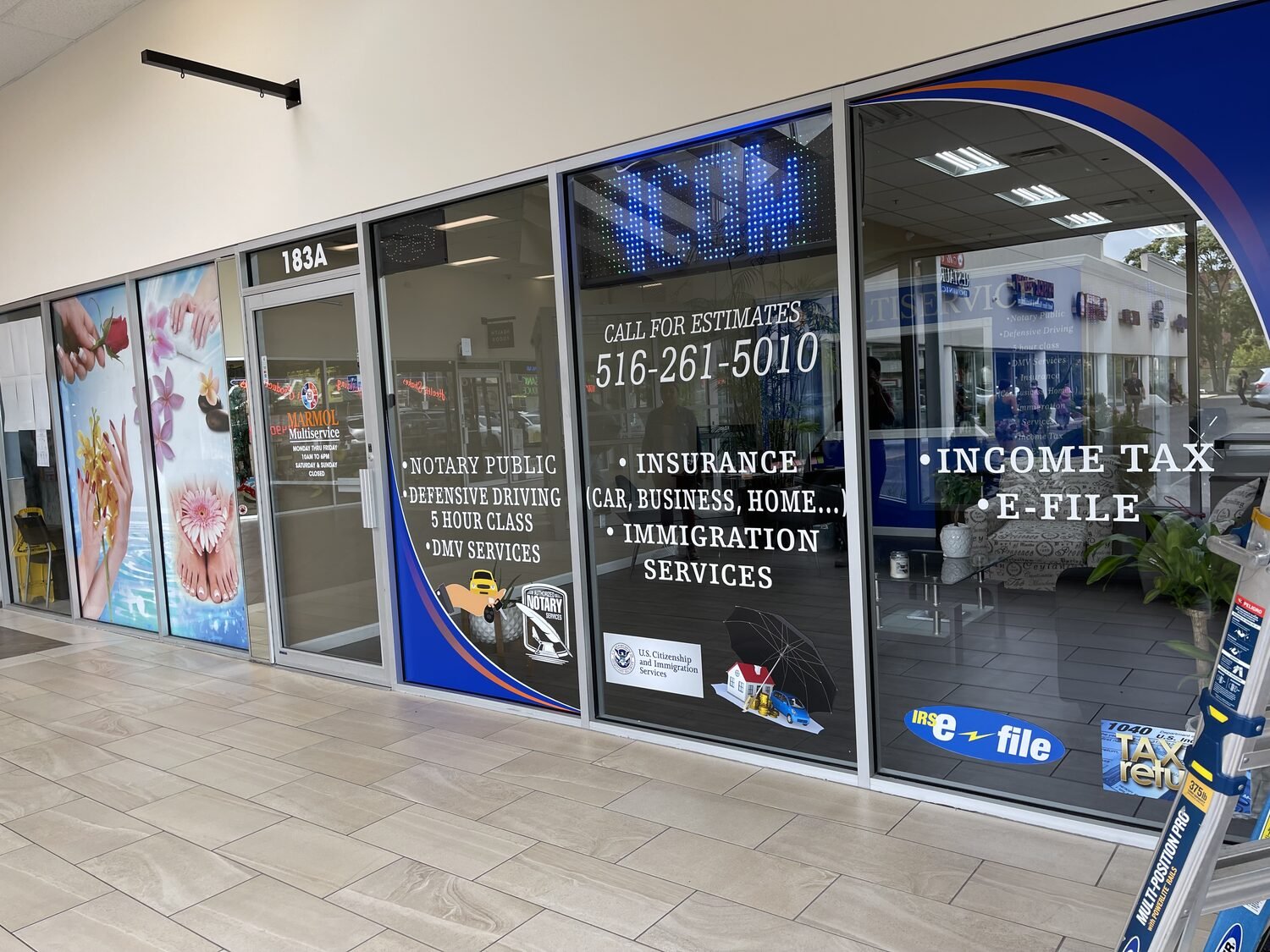 Window lettering and service list for De Multiservice