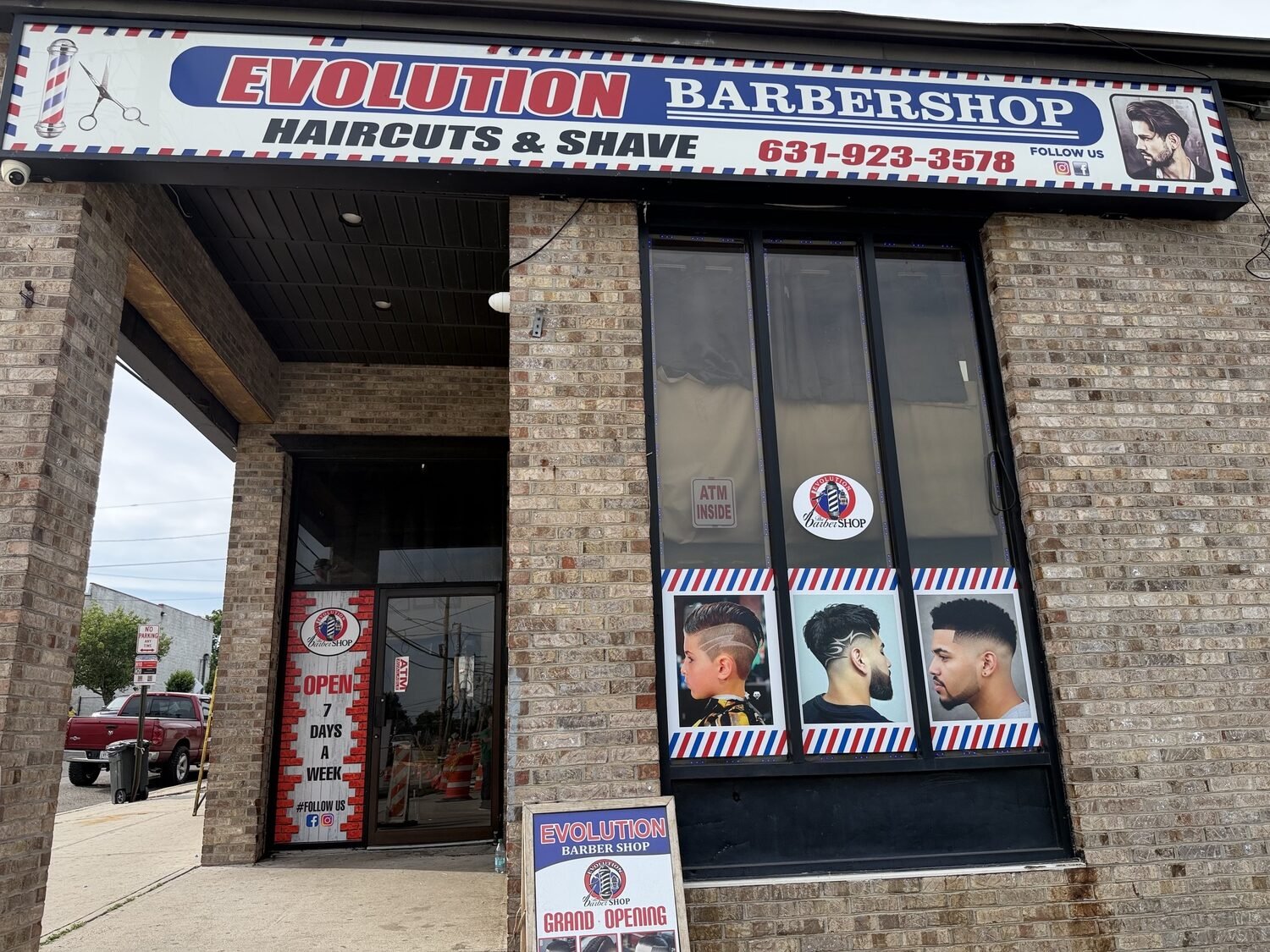 Window graphics and awning for Evolution Barbershop
